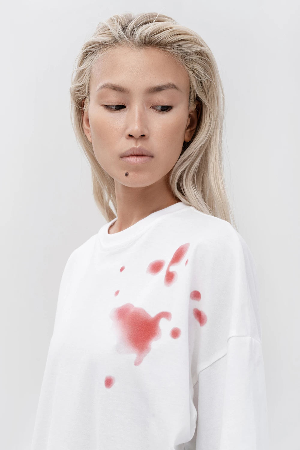 T-SHIRT WITH RED STAINS